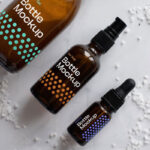 Top View Different Sizes Cosmetics Amber Bottles Mockup