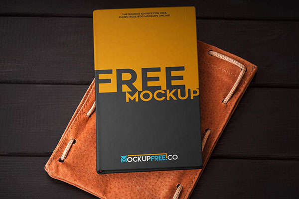 Top View Hardcover Notebook Laid Down on Leather Mockup