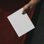 Top View Male Hand Holding Book Mockup