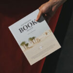 Top View Male Hand Holding Book Mockup