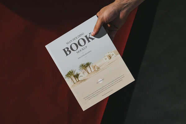Top View Male Hand Holding Book Mockup