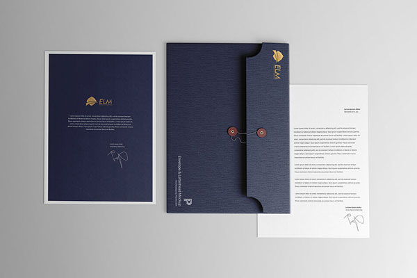 Top View Mockup of Envelope Between Two Letterhead Pages