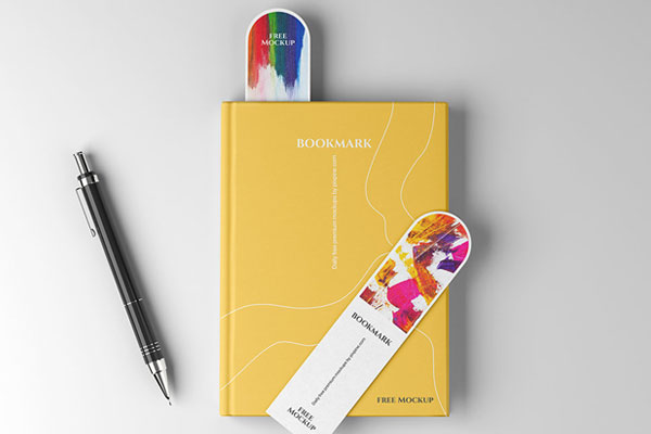 Top View of 2 Bookmark Mockups on a Book Cover
