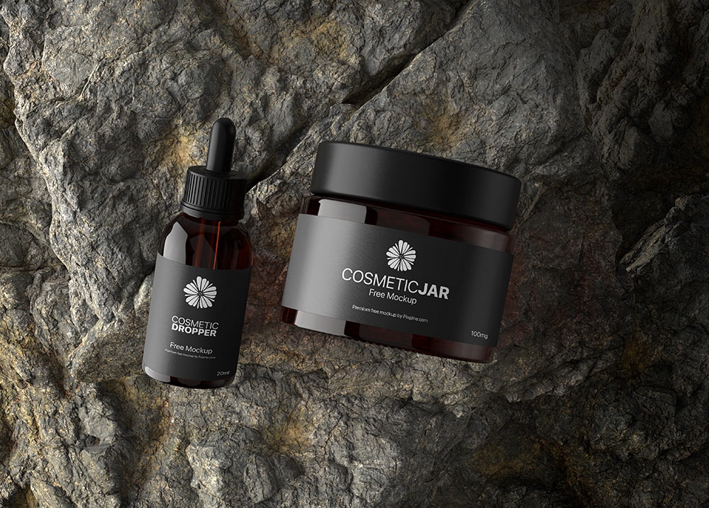 Top View of a Cosmetic Jar and Dropper on a Rock Mockup