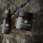 Top View of a Cosmetic Jar and Dropper on a Rock Mockup