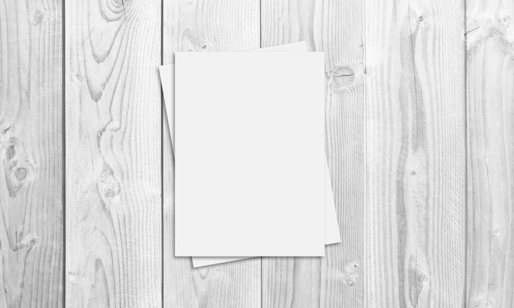 Top View of a Flyer/Poster on a Wooden Table Mockup