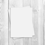 Top View of a Flyer/Poster on a Wooden Table Mockup