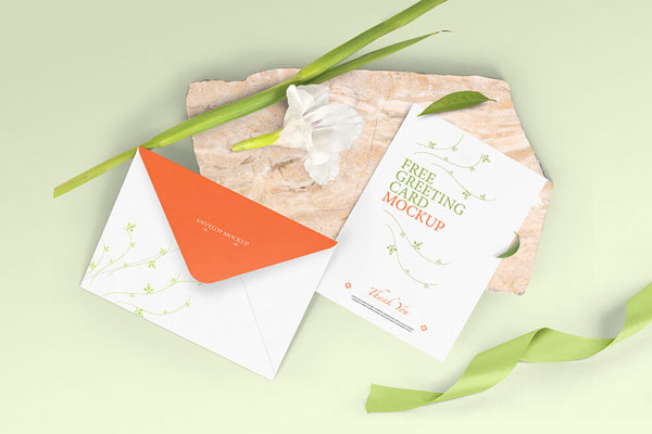 Top View of a Greeting Card with Its Envelope Mockup