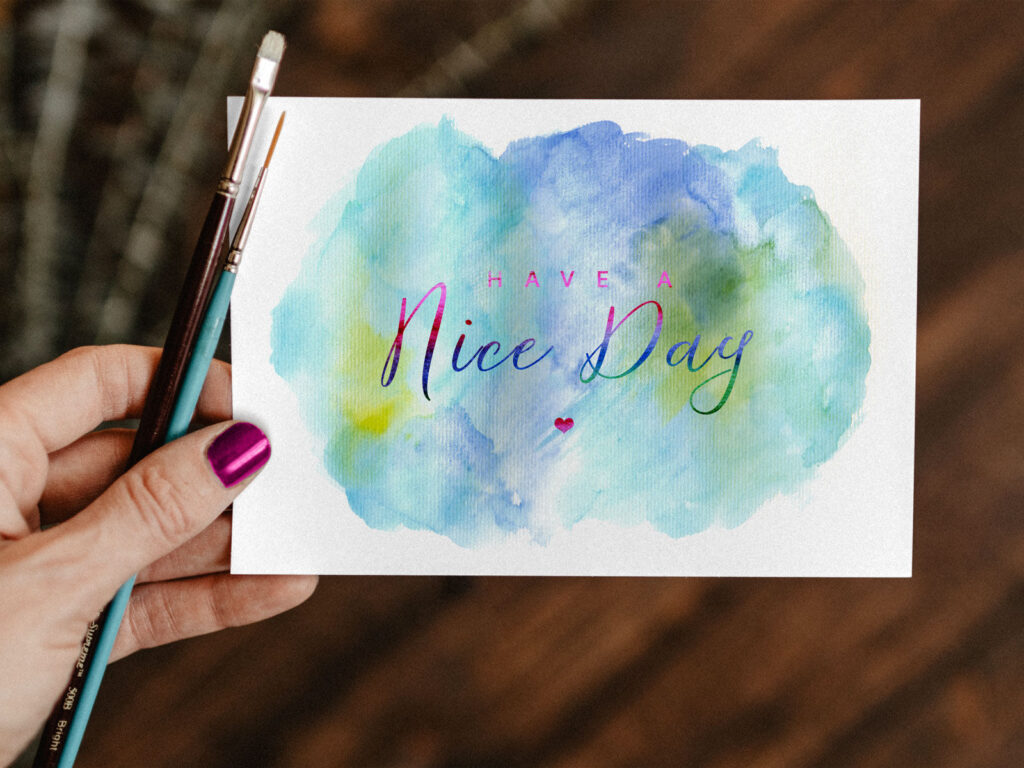 Top View of A Greeting Card Mockup In A Woman’s Hand