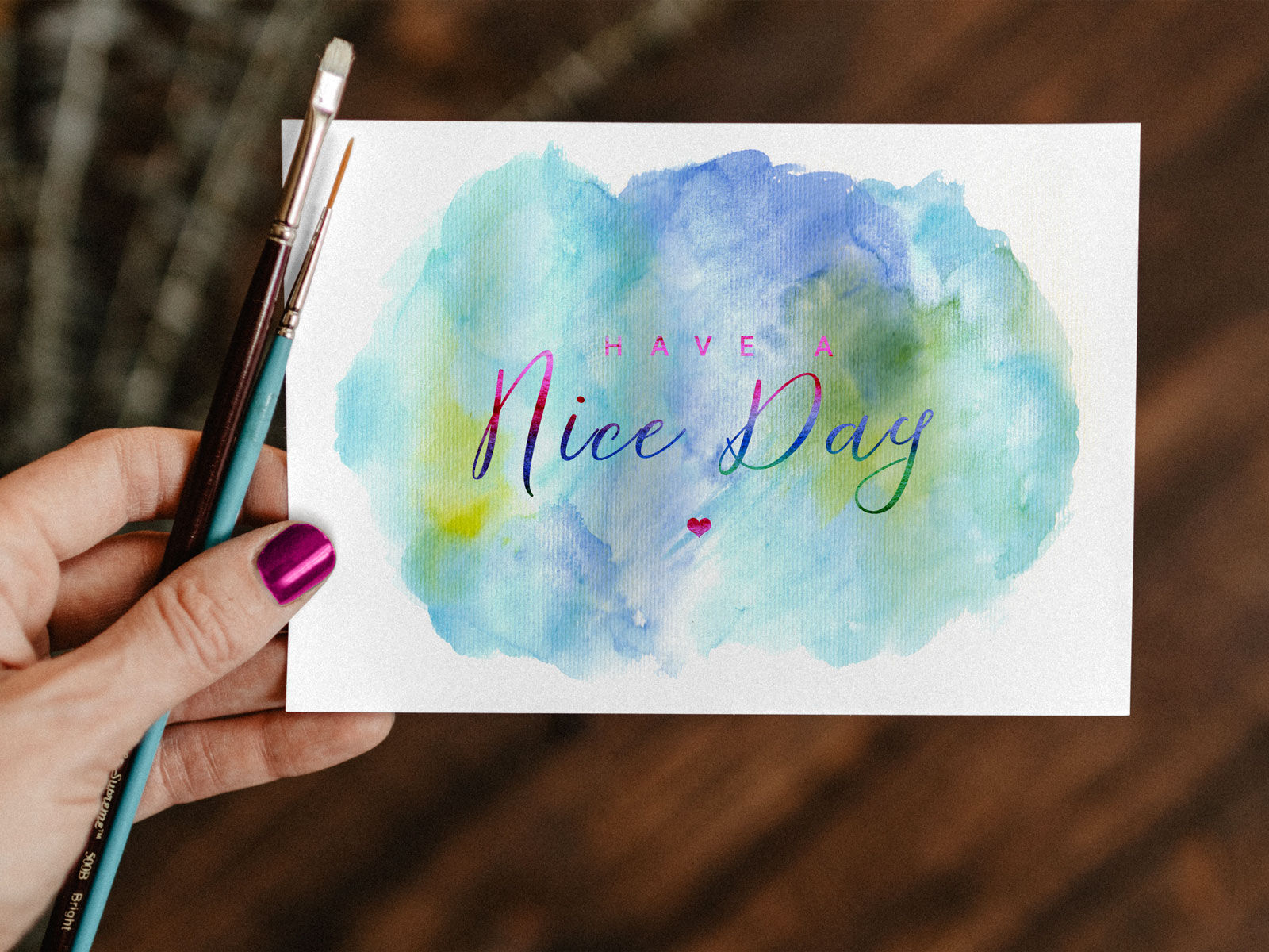 Top View of A Greeting Card With Watercolor Painting Mockup In A Woman's Hand FREE PSD