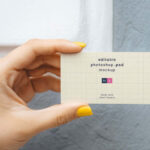 Top View of a Hand Holding a Business Card Mockup