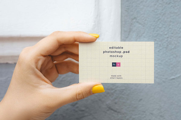 Top View of a Hand Holding a Business Card Mockup