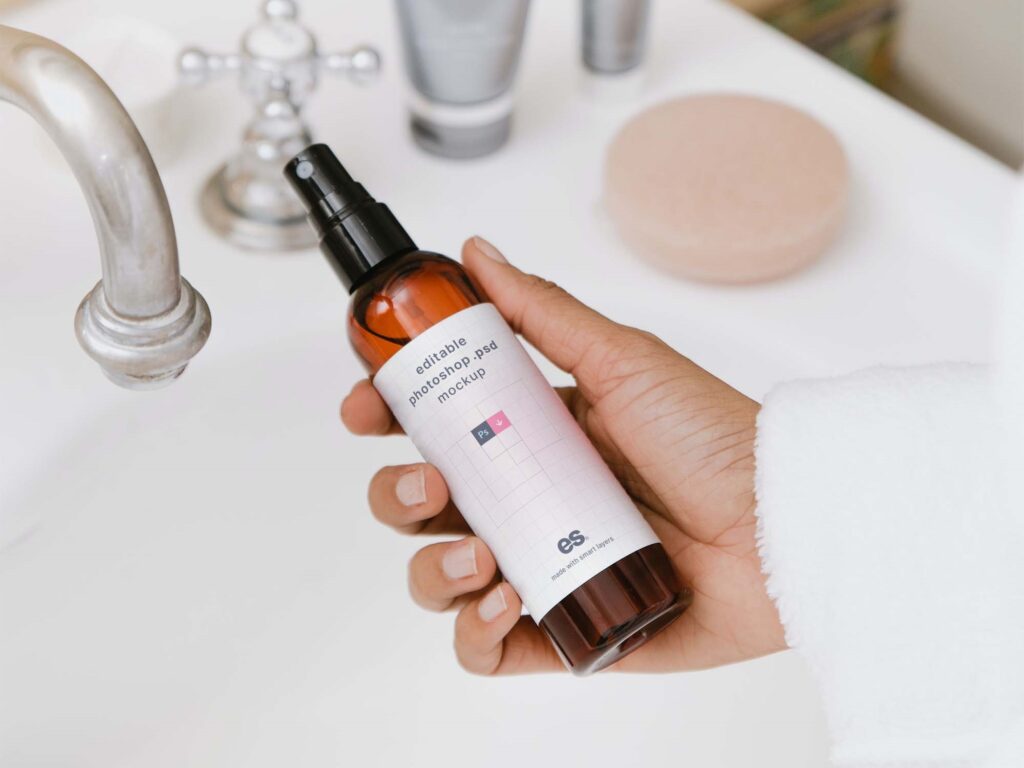 Top View of a Hand Holding Pump Spray Bottle Mockup