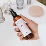 Top View of a Hand Holding Pump Spray Bottle Mockup