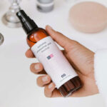 Top View of a Hand Holding Pump Spray Bottle Mockup