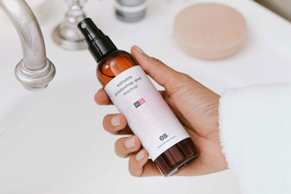 Top View of a Hand Holding Pump Spray Bottle Mockup