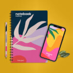 Top View of a Notebook with iPhone 12 and a Pen Mockup