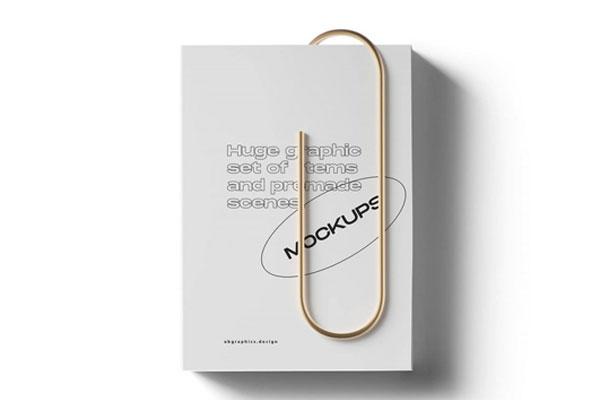 Top View of a Realistic Closed Book with Clip Mockup