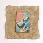 Top View of a Softcover Book on a Wrinkled Paper Mockup