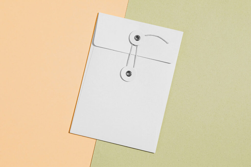 Top View of a Thread and Pin Craft Envelope Mockup
