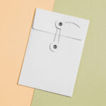 Top View of a Thread and Pin Craft Envelope Mockup