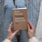 Top View of a Woman Holding Book Cover Mockup