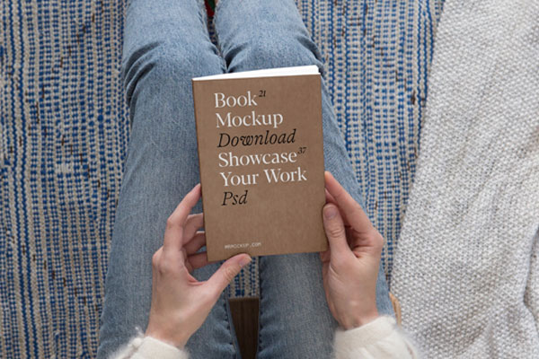 Top View of a Woman Holding Book Cover Mockup