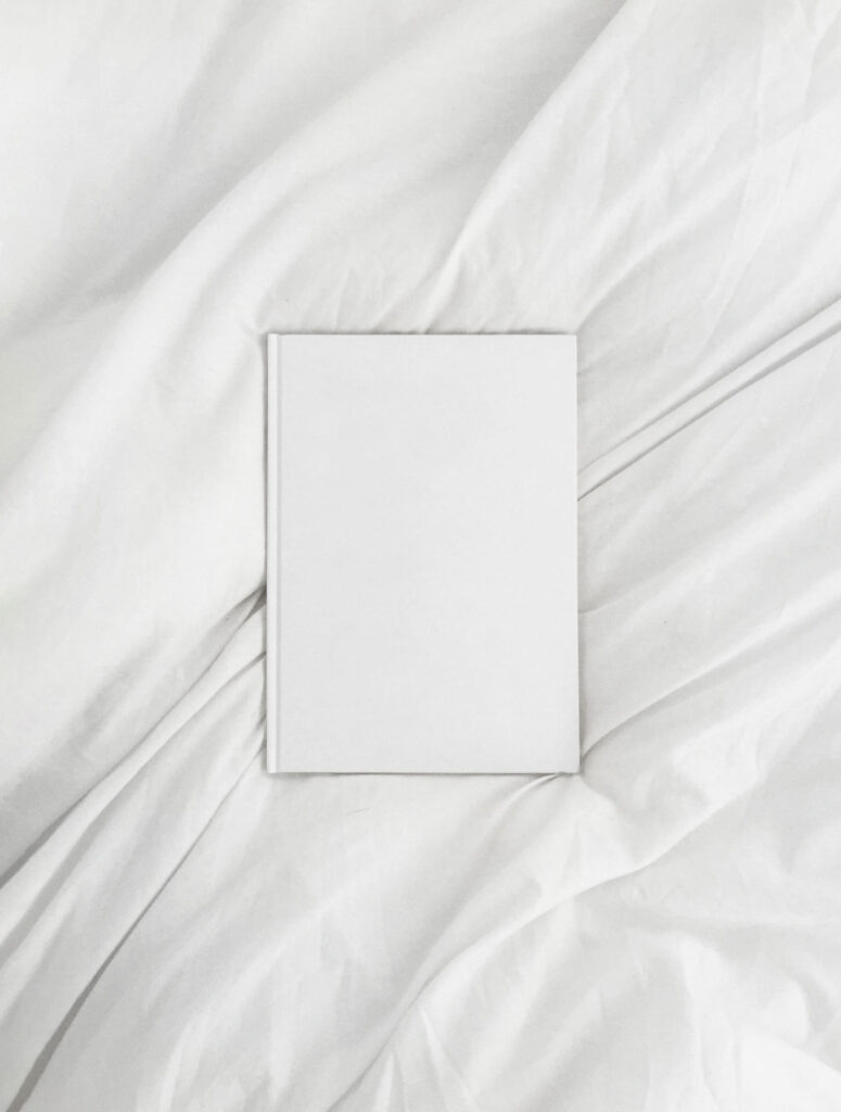 Top View of an A4 Book Hardcover on a Sheet Mockup
