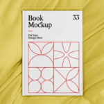 Top View of an A4 Book Hardcover on a Sheet Mockup