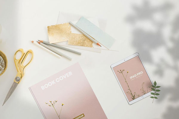 Top View of an iPad Pro and a Book Cover Mockup