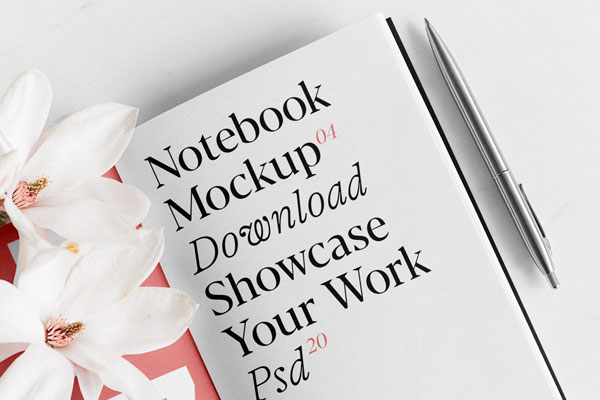 Top View of Artistic Notebook Mockup with Flowers