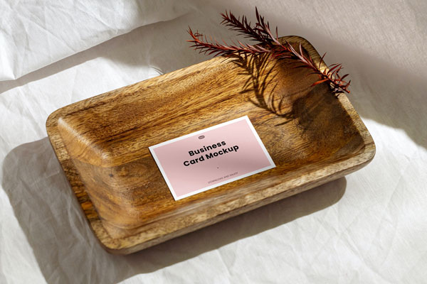 Top View of Business Card Mockup in Deep Wood Plate
