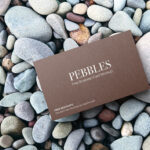 Top View of Business Card Mockup on Pebbles