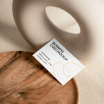 Top View of Business Card Mockup on Wooden Plate