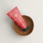 Top View of Cosmetic Tube Mockup on a Wooden Cup