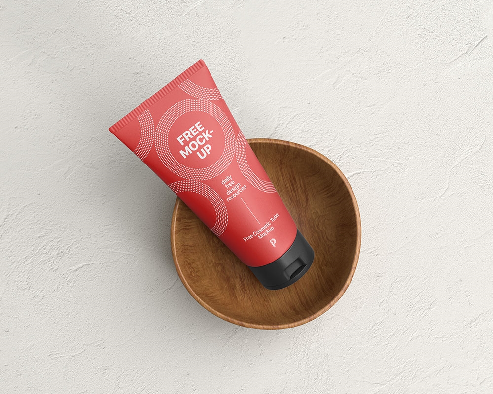 Top View of Cosmetic Tube Mockup on a Wooden Cup