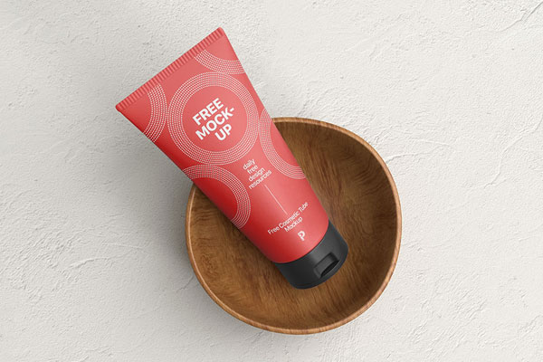 Top View of Cosmetic Tube Mockup on a Wooden Cup