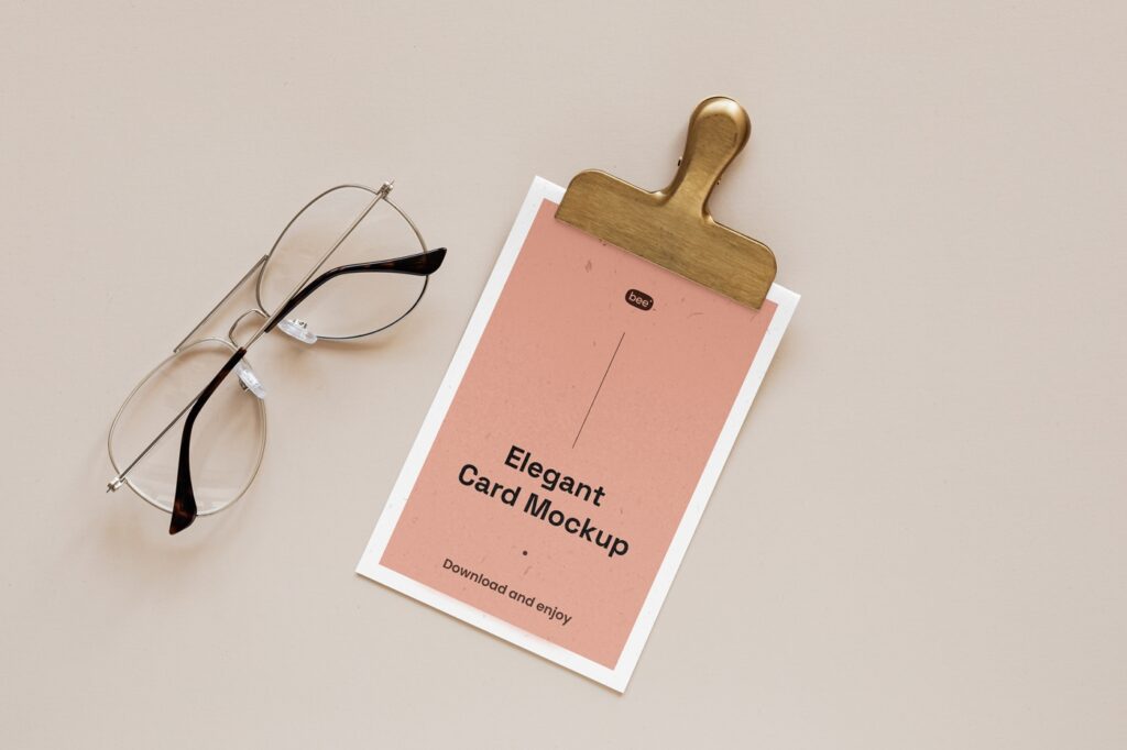 Top View of Elegant Card Mockup Featuring Clip and Glasses