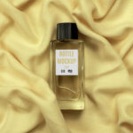 Top View of Glass Bottle Perfume Mockup on Fabric