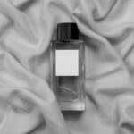 Top View of Glass Bottle Perfume Mockup on Fabric