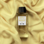 Top View of Glass Bottle Perfume Mockup on Fabric