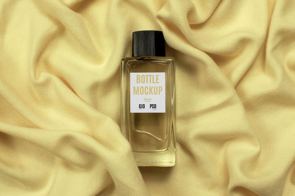 Top View of Glass Bottle Perfume Mockup on Fabric
