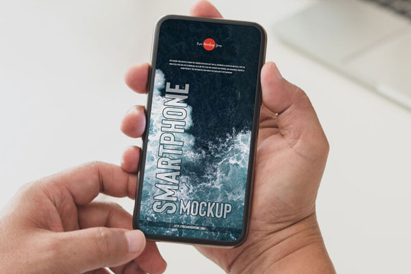 Top View of Hand Holding Smartphone Mockup