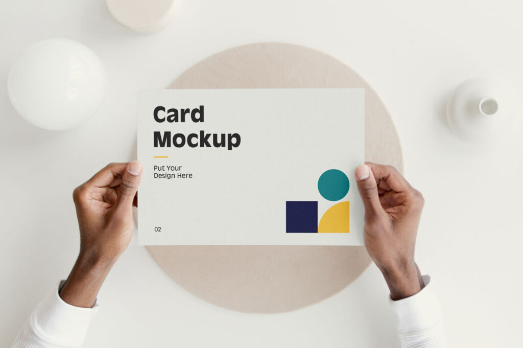 Top View of Hands Holding a Card Mockup