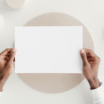 Top View of Hands Holding a Card Mockup