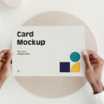 Top View of Hands Holding a Card Mockup