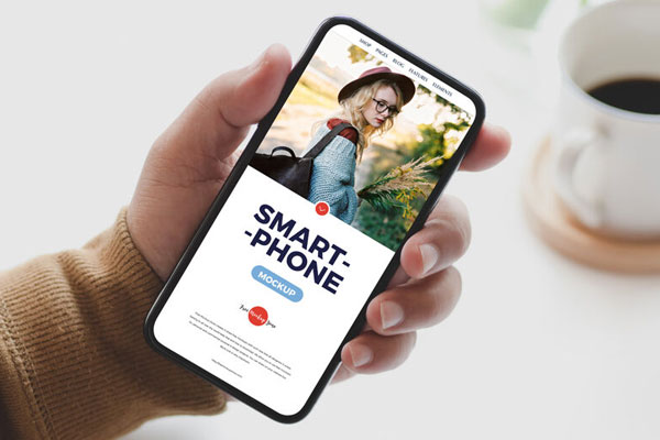 Top View of Man Holding Smartphone Mockup