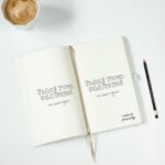 Top View of Open Notebook Mockup with Coffee Cup