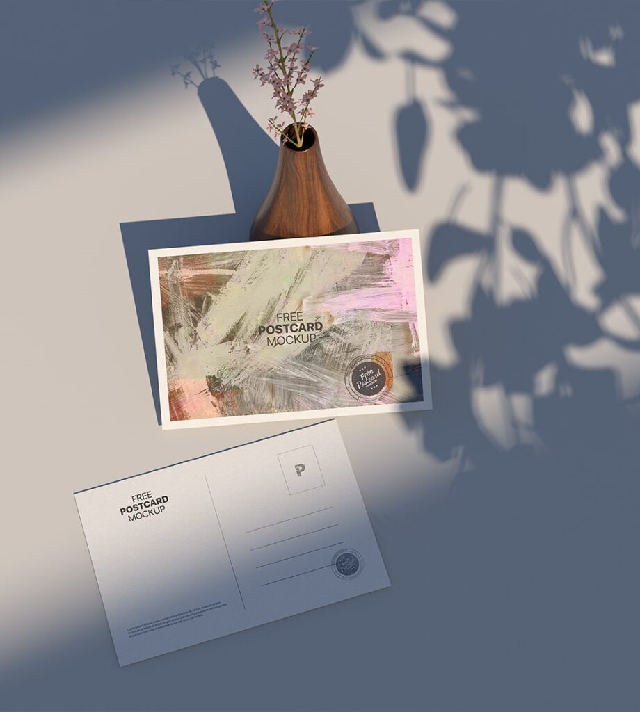 Top View of Postcard Mockup Against the Rustic Vase