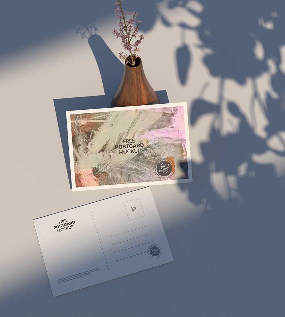 Top View of Postcard Mockup Against the Rustic Vase FREE PSD